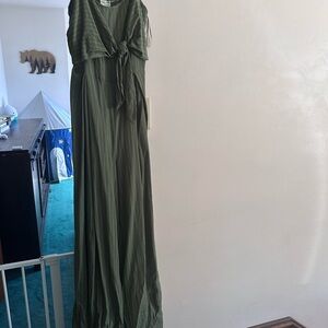 Green jumpsuit with thin white vertical stripes- open back